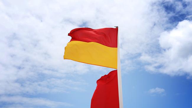 A red and yellow flag at a Gold Coast beach. Picture: Brendan Radke.