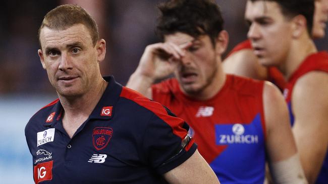 Demons coach Simon Goodwin, wearing a black arm band, was also mourning a family member on Monday. Pic: AAP