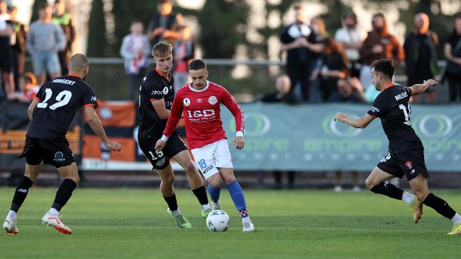 Melbourne Knights’ Jack Morton takes on the Brisbane Roar defence. Picture: Jonathan DiMaggio