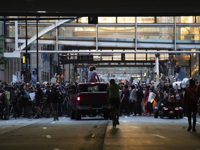 Demonstrators march through downtown Minneapolis. Picture: AP