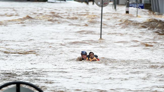 Emergency Services rescue a man from the centre of Lismore after heavy flooding in town.