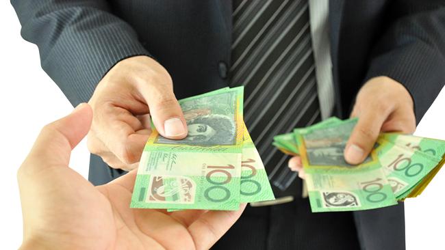 Businessman hand giving money - Australian dollars