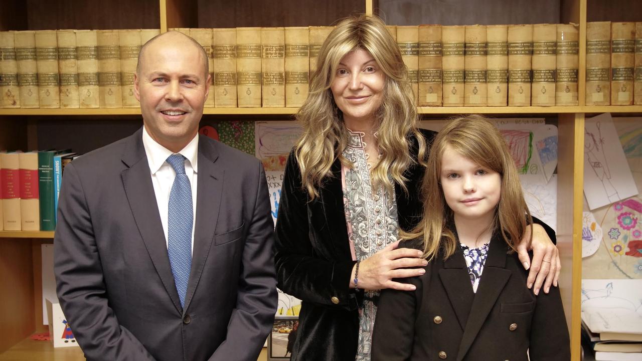 Treasurer Josh Frydenberg with Alison Day and her daughter Matilda on the night of the budget.