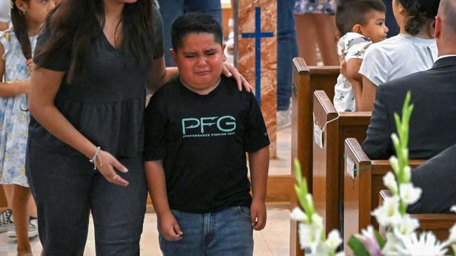 A boy returns to his seat after children were called up by Father Eduardo Morales as US President Joe Biden and First Lady Jill Biden attend Mass at Sacred Heart Catholic Church in Uvalde, Texas. Picture: AFP