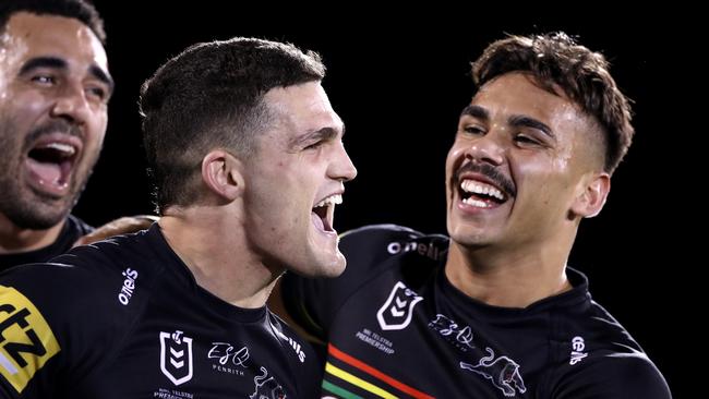 SYDNEY, AUSTRALIA - AUGUST 21: Tyrone May, Nathan Cleary and Daine Laurie of the Panthers celebrate after winning the round 15 NRL match between the Penrith Panthers and the Cronulla Sharks at Panthers Stadium on August 21, 2020 in Sydney, Australia. (Photo by Mark Kolbe/Getty Images)