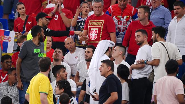 Security staff speak with fans during Group G match between Serbia and Switzerland. Picture: Getty Images