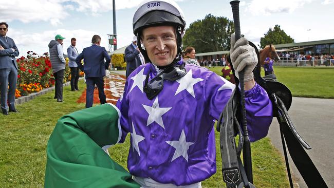 Jockey Craig Newitt celebrates his victory on Deroche after winning the Vamos Stakes at the Launceston Cup from Mowbray Racecourse. Picture: ZAK SIMMONDS