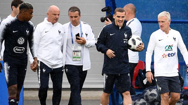 France's head coach Didier Deschamps (R) and forward Antoine Griezmann (2nd R) attend a training session at the Glebovets stadium in Istra, some 70km west of Moscow.