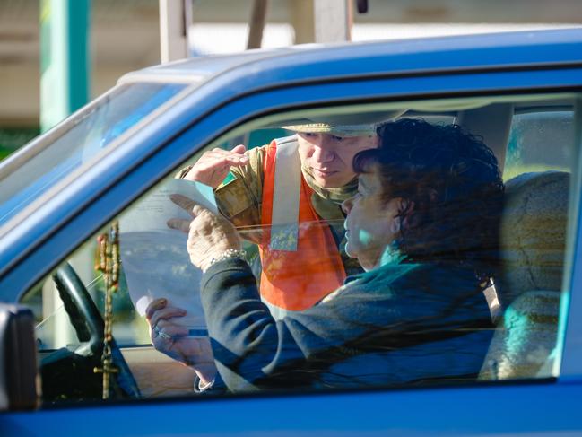 This woman shows her permit at the border. Picture: Simon Dallinger/NCA NewsWire