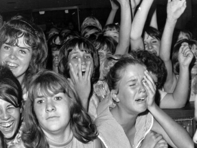 Fans greeting band The Beatles at Los Angeles International Airport 18 Aug 1964. Picture: Ap