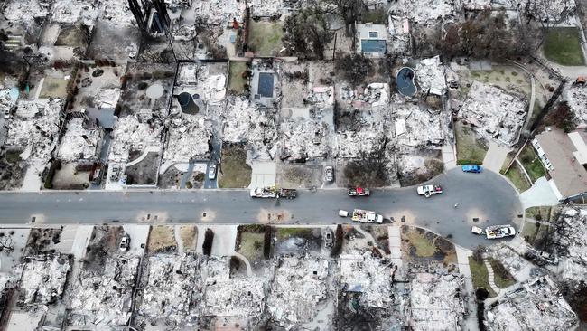 ALTADENA, CALIFORNIA - JANUARY 25: An aerial view of homes which burned in the Eaton Fire on January 25, 2025 in Altadena, California. Southern California is facing the first significant rainfall of this winter and areas which recently burned in wildfires face a small risk of flash flooding or mudslides. Multiple wildfires fueled by intense Santa Ana Winds burned across Los Angeles County leaving at least 28 dead with over 180,000 people having been under evacuation orders. Over 12,000 structures, many of them homes and businesses, burned in the Palisades and Eaton Fires. President Donald Trump surveyed wildfire damage yesterday and pledged to 'open the coffers' for federal aid to California.   Mario Tama/Getty Images/AFP (Photo by MARIO TAMA / GETTY IMAGES NORTH AMERICA / Getty Images via AFP)