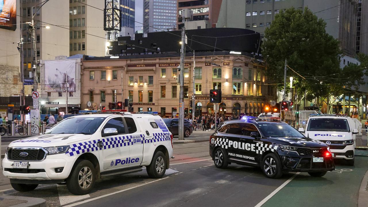 Police swarmed the Flinders Street intersection after the second incident unfolded. Picture: Ian Currie