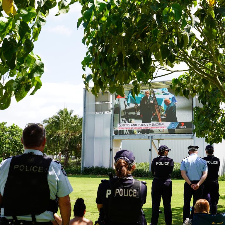 Dozens of local residents, as well as emergency services officers gathered at GPC’s East Shores to watch a live stream of the memorial service. Picture: Supplied