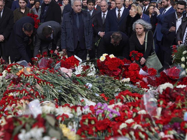 TOPSHOT - Israeli Ambassador to Russia, Simona Halperin (1st row - 2nd R) lays a bouquet of flowers during a flower laying ceremony along with ambassadors of foreign diplomatic missions at the memorial in memory of the victims of the terrorist attack at the Crocus City Hall concert venue a week after the attack in Krasnogorsk, outside Moscow on March 30, 2024. At least 144 people were killed and more than 100 hospitalized after a group of gunmen attacked the concert hall in the Moscow region on 22 March evening, Russian officials said. Eleven suspects, including all four gunmen directly involved in the terrorist attack, have been detained, according to Russian authorities. (Photo by SERGEI ILNITSKY / POOL / AFP)