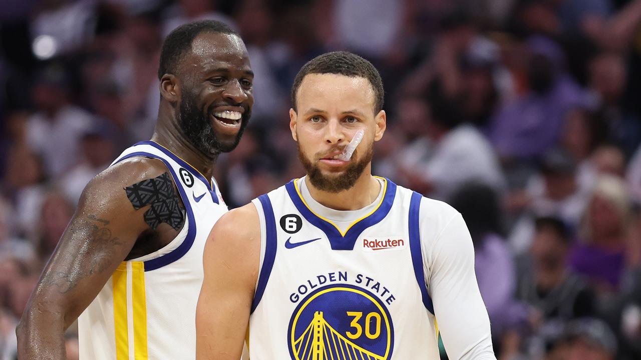 Stephen Curry #30 of the Golden State Warriors and Draymond Green #23 react in game seven of the Western Conference Playoffs against Sacramento. Photo by Ezra Shaw/Getty Images