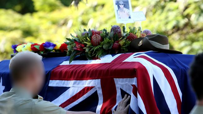 Signaller Sean McCarthy is laid to rest in a military service in Australia.