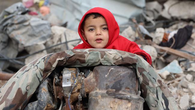 A Palestinian child amid the rubble of destroyed buildings in the northern Gaza Strip this week. Picture: Omar Al-Qattaa / AFP