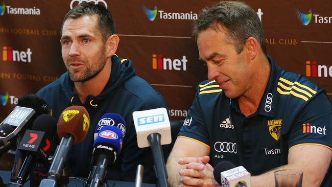 Luke Hodge announces his retirement next to coach Alastair Clarkson in July.