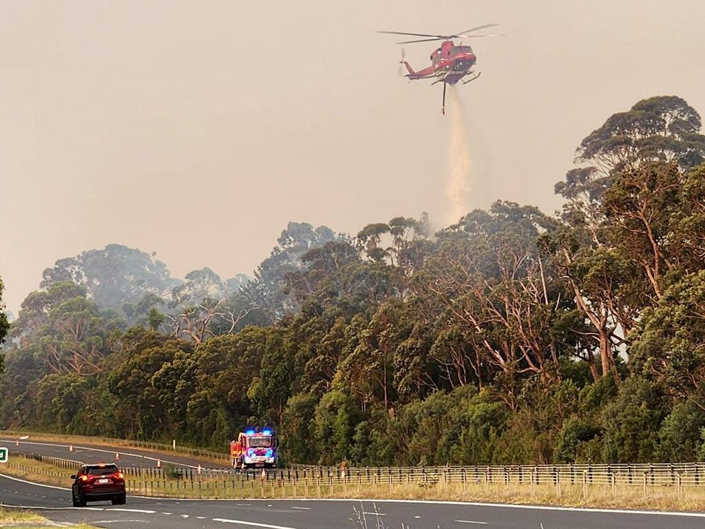 Aircraft drop water over the bushfire in The Gurdies. Picture: Trevor Owen