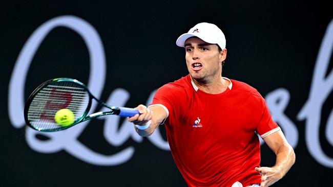 Christopher O’Connell plays a forehand in his match against Alexei Popyrin of Australia during day one of the 2024 Brisbane International. Picture: Bradley Kanaris/Getty Images.