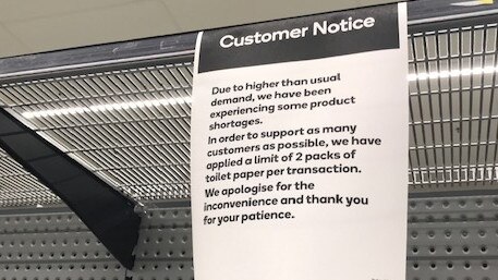 A customer notice at Woolworths advising customers about the two pack limit. Photo:Melissa Seiler.