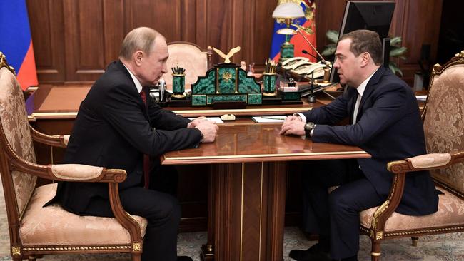 Vladimir Putin, left, with Dmitry Medvedev in Moscow on the day the latter resigned as Russian prime minister. Picture: AFP