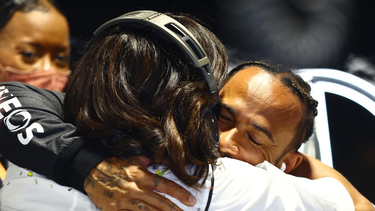 Lewis Hamilton of Great Britain hugs Michelle Obama. Picture: AFP