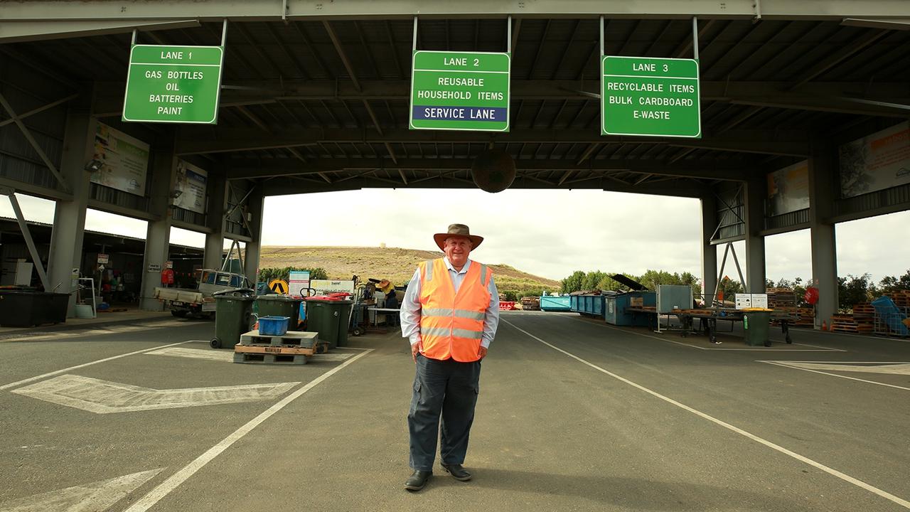 Councillor Neil Fisher at The Lakes Creek Road Waste Management Facility recycling area.