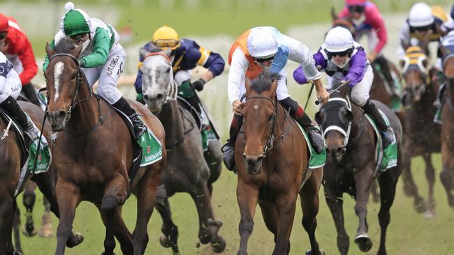 Montefilia (orange and blue, white cap) gave trainer David Payne his 107th Group 1 win in last week’s The Metropolitan. Picture: Getty Images