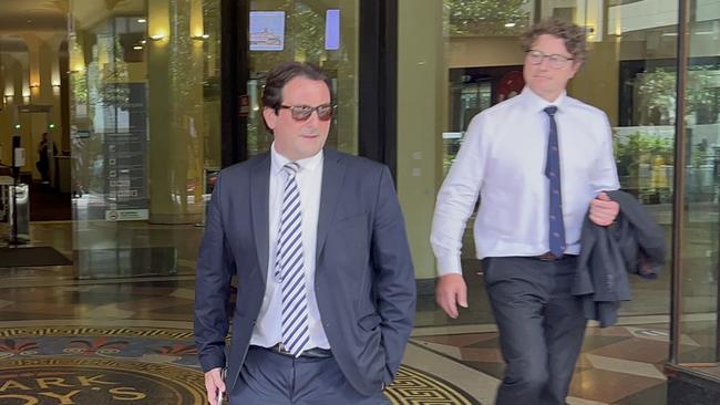 John Balafas walking out of Sydney Downing Centre Local Court with his lawyer on Friday.