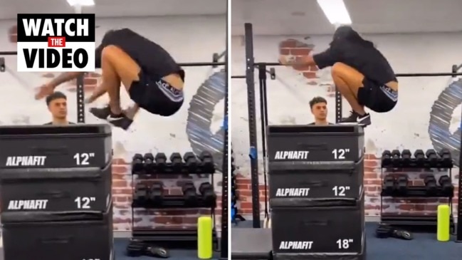 AFL star Shai Bolton performs a huge box jump in the gym