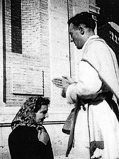 Leonard Faulkner giving his first blessing as a priest – to Mary Guerin – after his ordination in Rome in 1950.