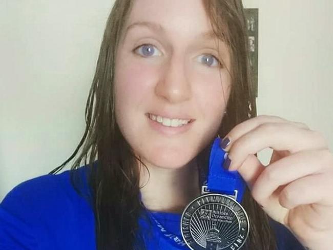 Louise Horton with her medal after completing the half marathon.