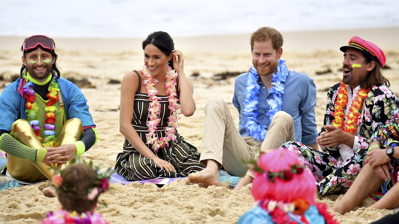 Lei’d back Royals... Meghan and Harry on Bondi beach today. Picture: AP