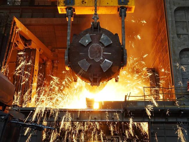 Chinese steel was the target of the tariffs that President Trump announced earlier this year. Pictured, a worker operates a furnace at a steel plant in Dalian, China. Picture: REUTERS