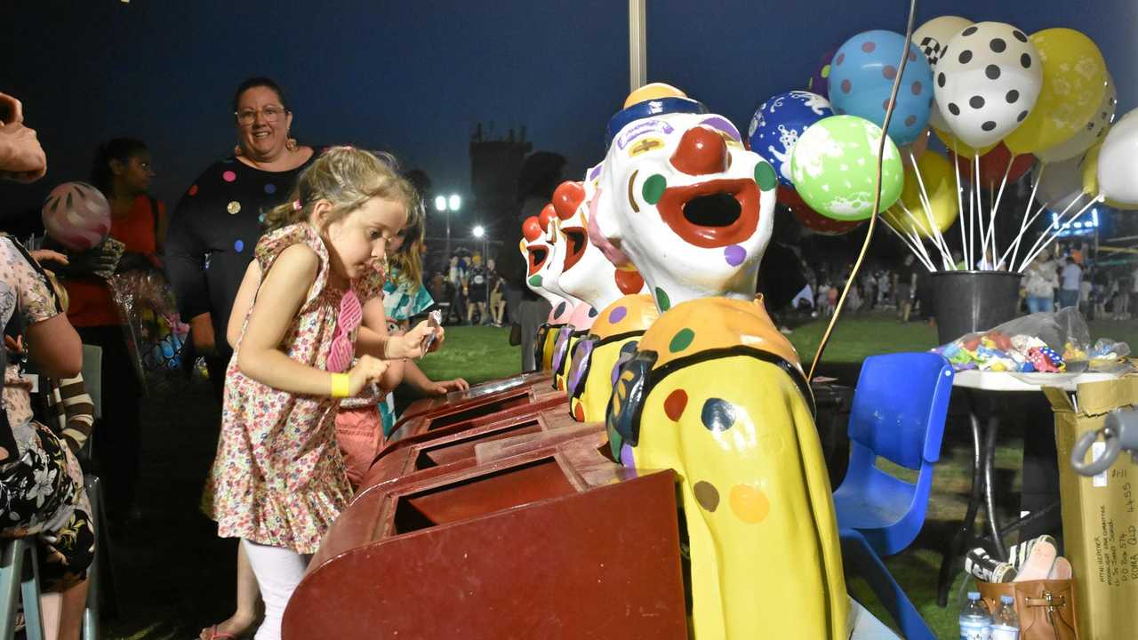 GAME OF SKILL: Fun times at the St John's Moonlight Fair on Friday night. Picture: Jorja McDonnell