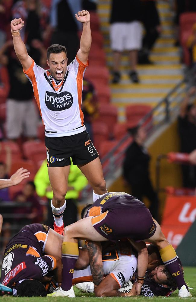 Luke Brooks celebrates Michael Chee Kam’s match winner. (AAP Image/Dave Hunt) 