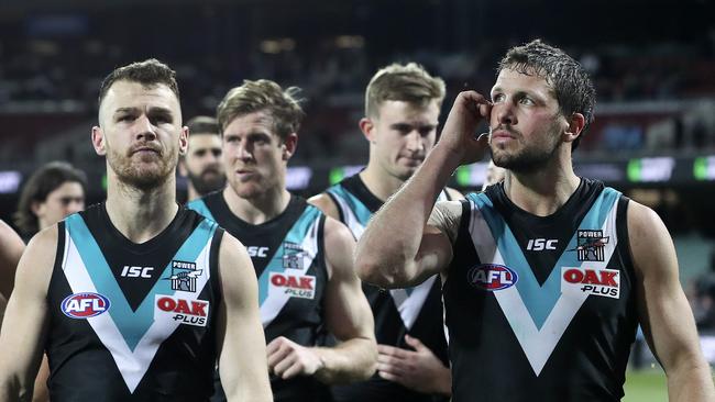 Travis Boak, right, scratches his head after Port Adelaide’s season-ending loss to Essendon last year. Picture: SARAH REED