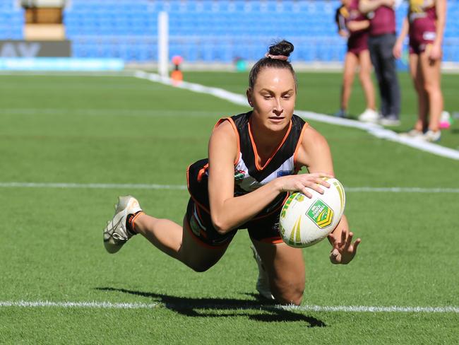 Paige Markey scoring for the Tigers in the touch football competition. Pic: Peter Tong