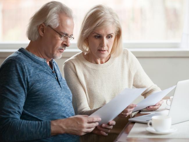 Serious worried senior couple calculating bills to pay or checking domestic finances stressed of debt, retired elderly old family reading documents concerned about loan bankruptcy money problems; Stressed seniors generic