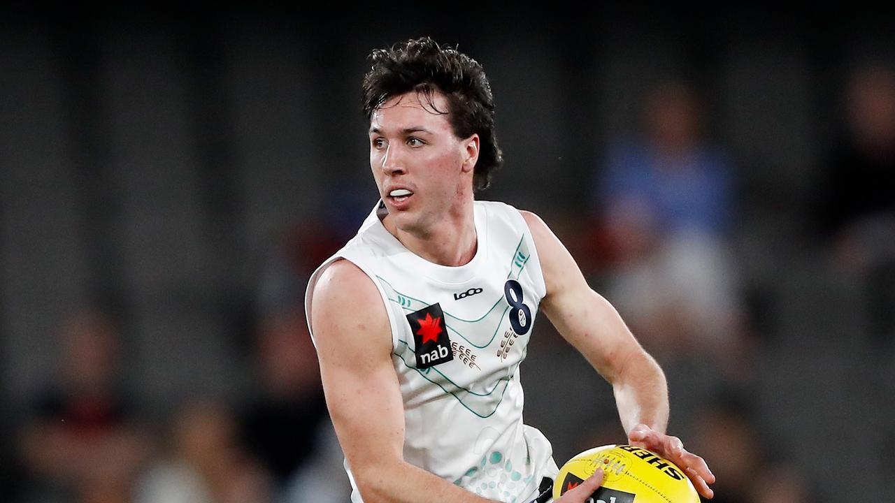 Oliver Hollands looks up to Carlton’s Sam Walsh. Picture: Getty Images