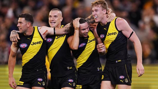 Jack Graham, Dustin Martin, Daniel Rioli and Tom Lynch celebrate their side’s preliminary final win. Pic: AAP