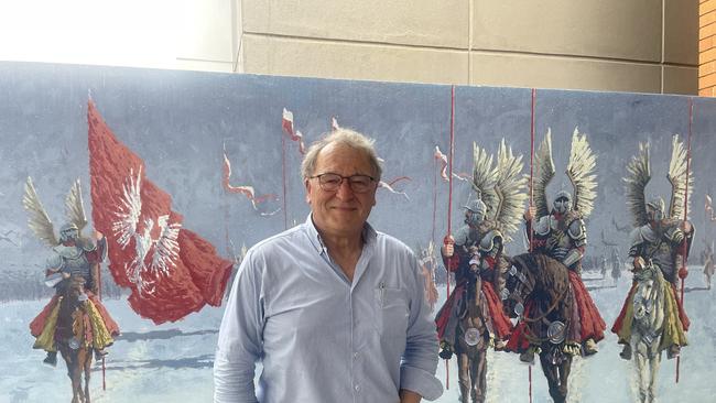 Polish Club president Stan Macionis in front of the Hussars mural. Photo: Glen Norris.