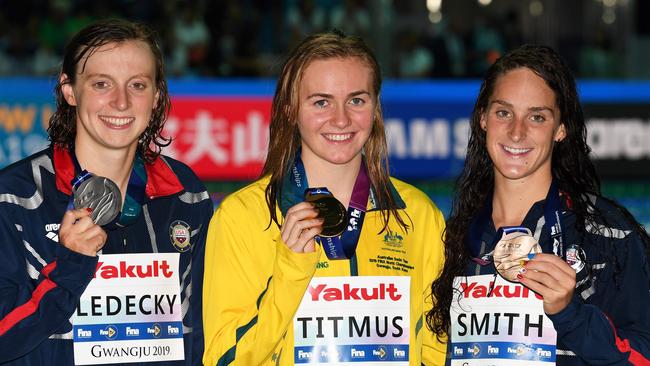 Gold medallist Australia's Ariarne Titmus (C), silver medallist USA's Katie Ledecky (L) and bronze medallist USA's Leah Smith pose with their medals after the final of the women's 400m freestyle event during the swimming competition at the 2019 World Championships at Nambu University Municipal Aquatics Center in Gwangju, South Korea, on July 21, 2019. (Photo by Oli SCARFF / AFP)