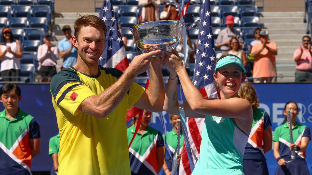 NEW YORK, NEW YORK – SEPTEMBER 10: Storm Sanders (R) of Australia and John Peers (L) of Australia celebrate with the championship trophy after defeating Kirsten Flipkens of Belgium and Edouard Roger-Vasselin of France during their Mixed Doubles Final match on Day Thirteen of the 2022 US Open at USTA Billie Jean King National Tennis Center on September 10, 2022 in the Flushing neighbourhood of the Queens borough of New York City. (Photo by Mike Stobe/Getty Images)