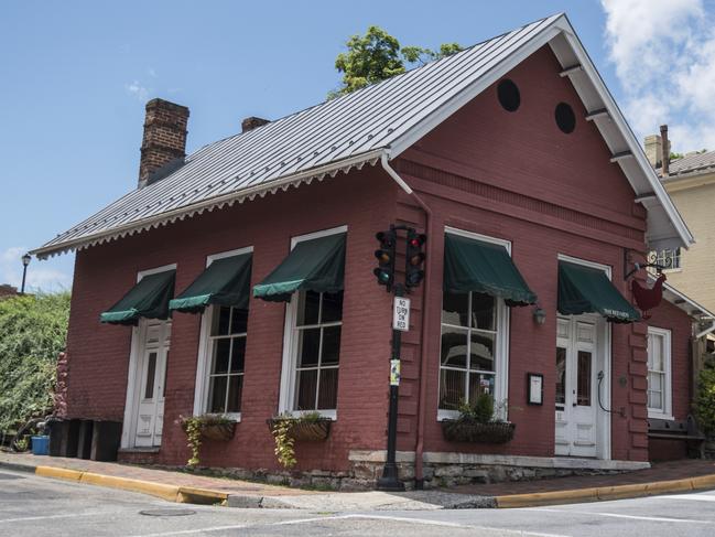 This Saturday, June 23, 2018 photo shows the Red Hen Restaurant in downtown Lexington, Va. White House press secretary Sarah Huckabee Sanders said Saturday in a tweet that she was booted from the Virginia restaurant because she works for President Donald Trump. Sanders said she was told by the owner of The Red Hen  that she had to "leave because I work for @POTUS and I politely left."  (AP Photo/Daniel Lin)