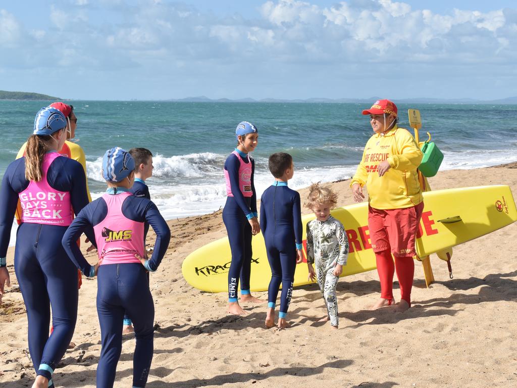 North Barrier Life Saving director Angela Blair with children in stinger suits at Mackay Harbour Beach on April 14, 2022. Picture: Lillian Watkins