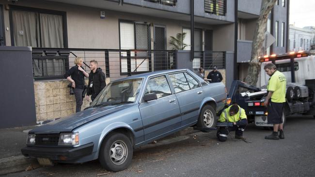 Police yesterday towed away two cars outside a Surry Hills home. Picture: Darren Leigh Roberts