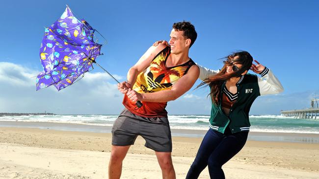 Logan Daruill and Jasmine Nichol from Brisbane on the beach at the Spit. Picture: John Gass