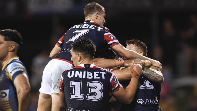 Sitili Tupouniua of the Roosters celebrates with team mates after scoring a try during the round 20 NRL match between the Sydney Roosters and the Parramatta Eels at BB Print Stadium, on July 29, 2021, in Mackay, Australia. Picture: Albert Perez – Getty Images